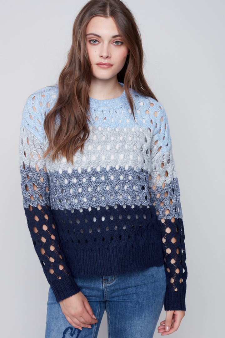 This unique sweater features a crew-neck and striped wavy net stitch for a standout look. 