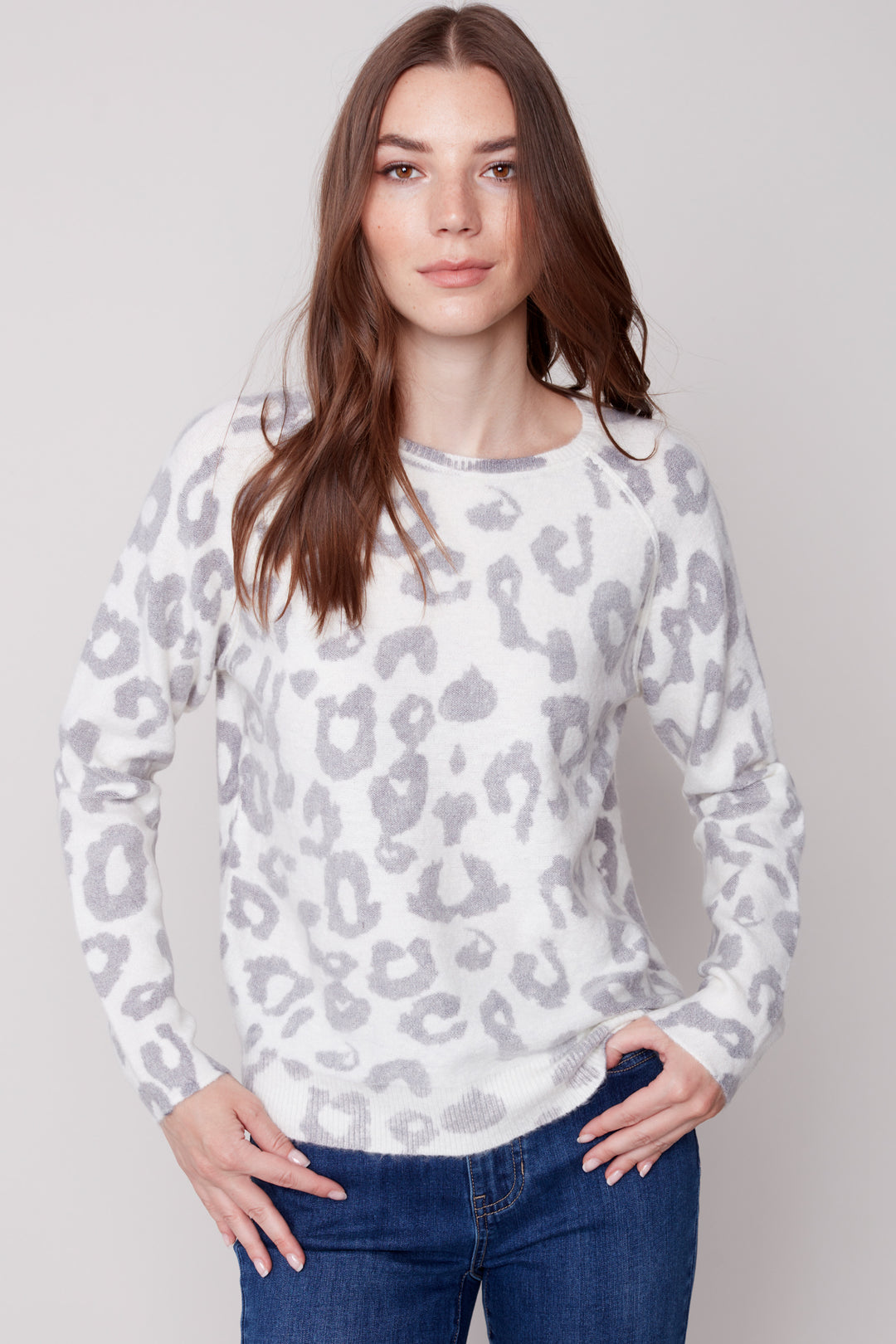 The printed crew neck sweater is designed with a crew-neck and raglan sleeve for a light, comfortable fit.