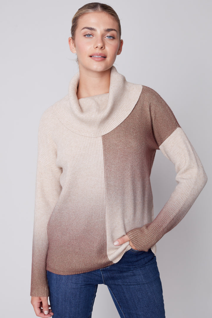 Our Cowl Neck printed sweater is the perfect top for cooler weather. The up and down print and elegant modern design make this sweater cozy and fashionable. Featuring a fall colour palette, this up and down ombré top is perfect for pairing with jeans or slacks. 