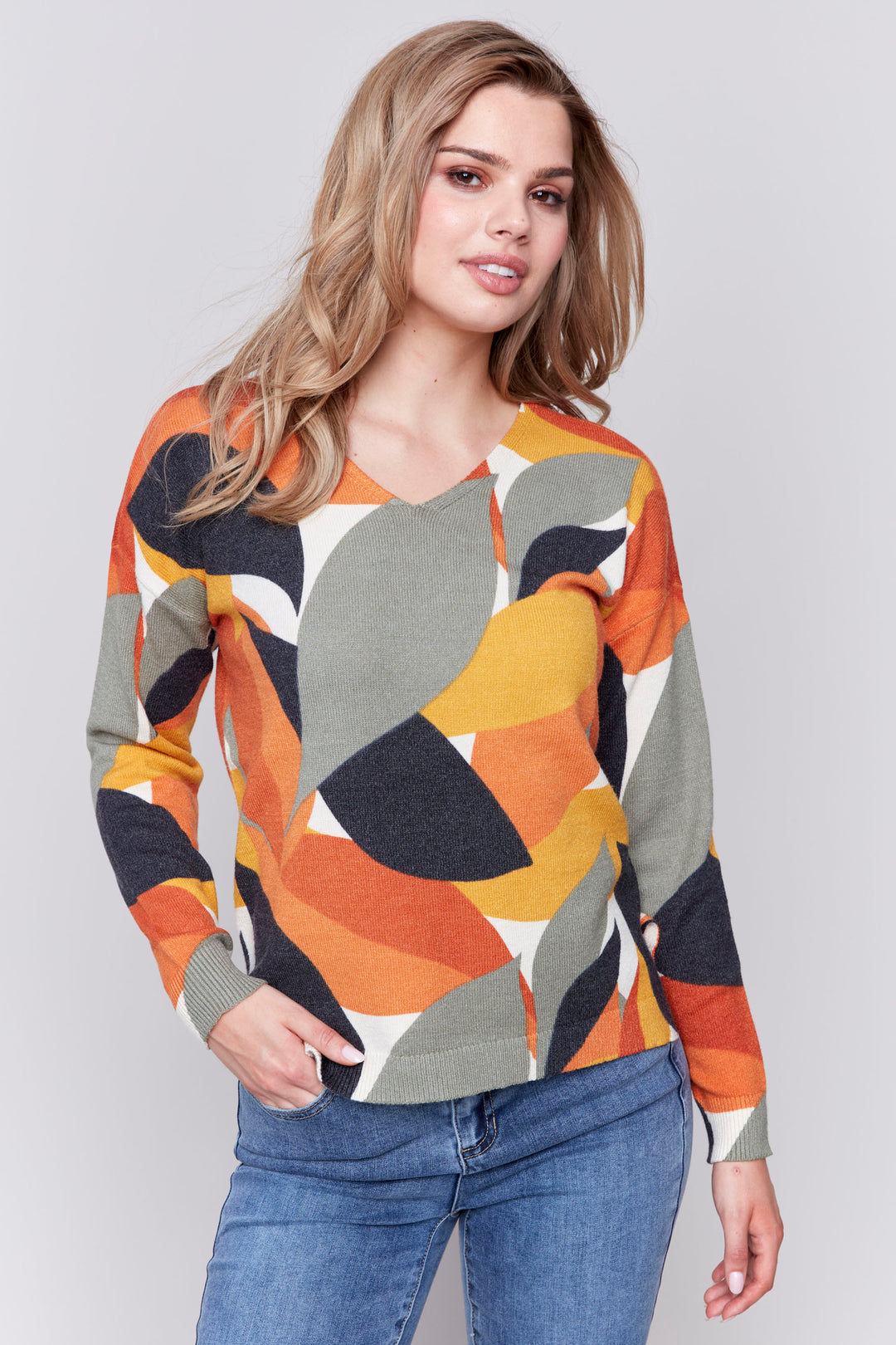 Charlie B Fall 2024  With its soft cut v-neck and light sweater material, this top is perfect for transitional weather. 