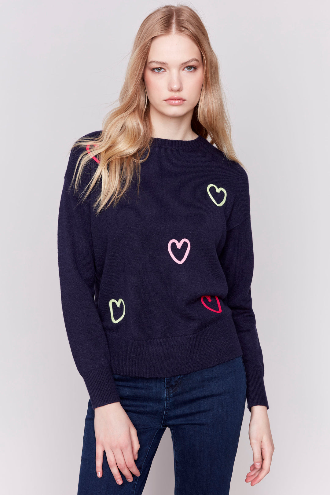 Charlie B Fall 2024 This beautiful sweater offers a cozy crew neck, round hemline and intricate embroidered heart details that make it perfect for any day!