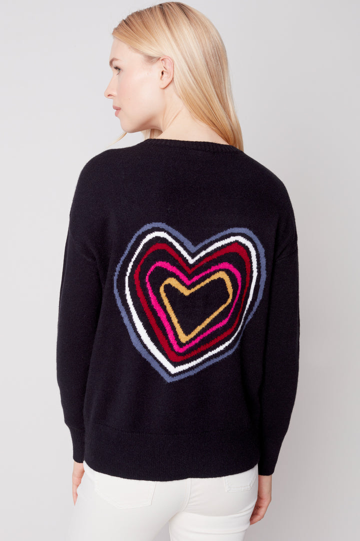 This ultra-soft, plush solid sweater features a crew-neck and an eye-catching heart on the back design. 