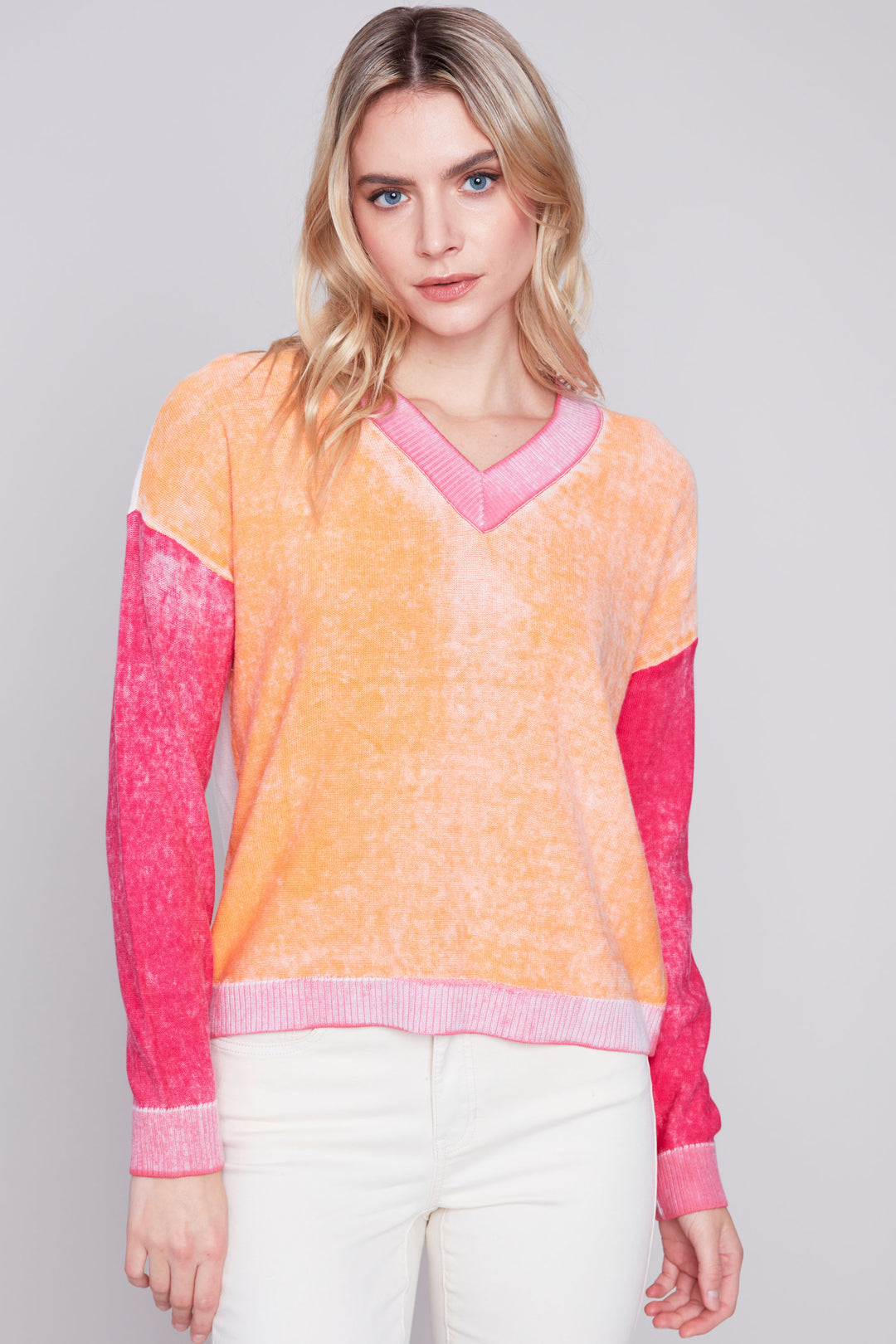 Perfect for summer, this all-cotton light sweater features blocks of fun colour and a smart v-neck style with long sleeves. 