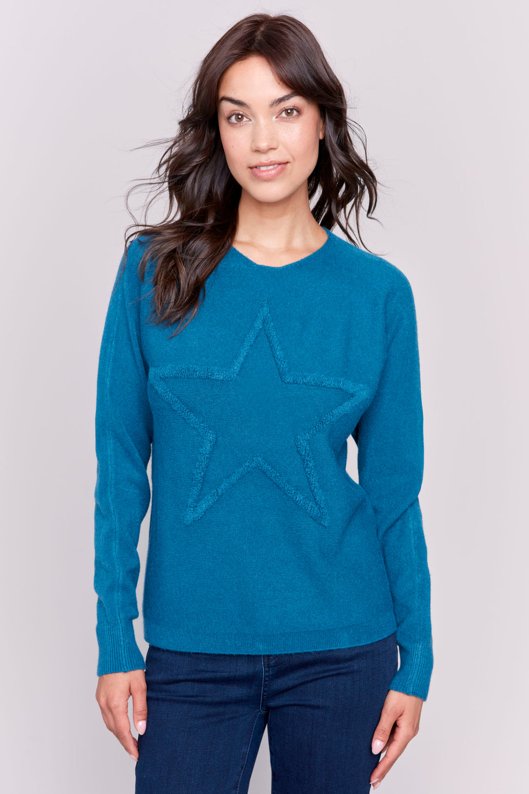 Charlie B Fall 2024  This light sweater top features a beautifully embroidered star, perfect for a classic and stylish look. 