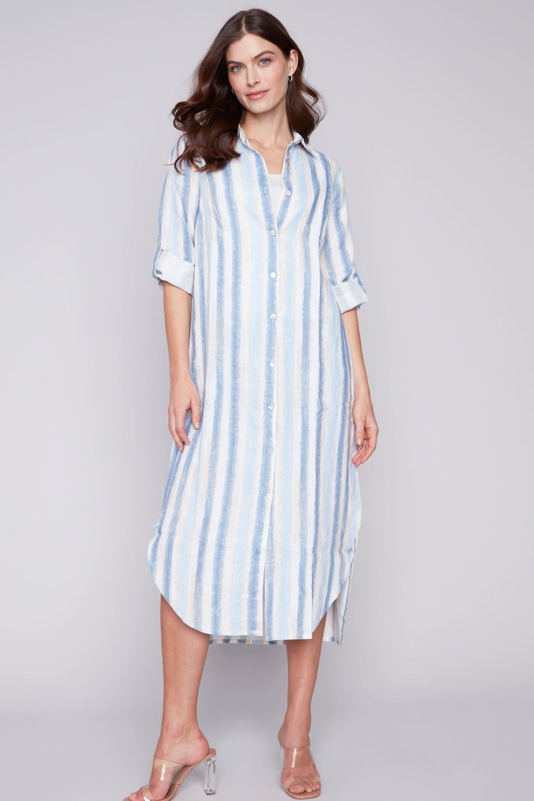 This striped duster dress effortlessly combines easy spring style and classic elegance with its airy, lightweight design and fabric, roll-up sleeves.
