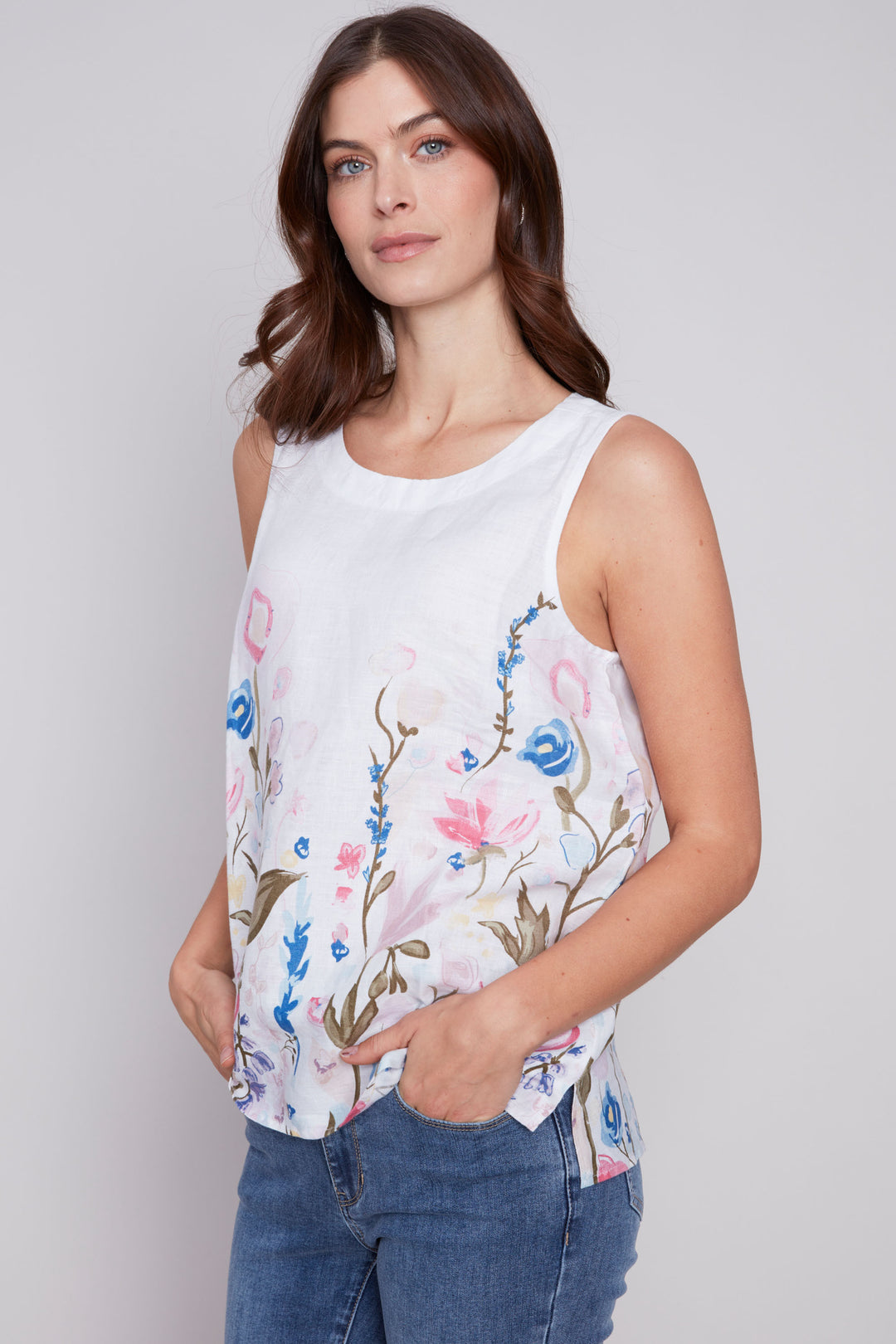 This lovely top features a colourful floral print and sleeveless design, perfect for warmer weather. 