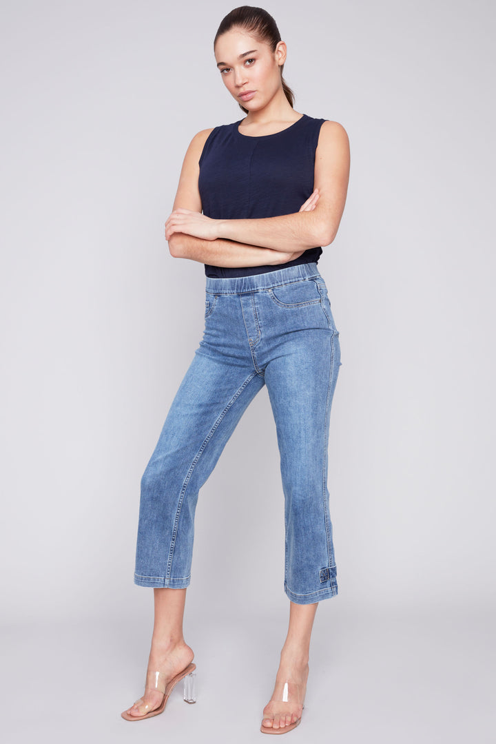 Expertly crafted with a classic 5 pocket design, our Crop Jean With Tab Hem offers a cropped length and regular fit for a chic and versatile look this season. 