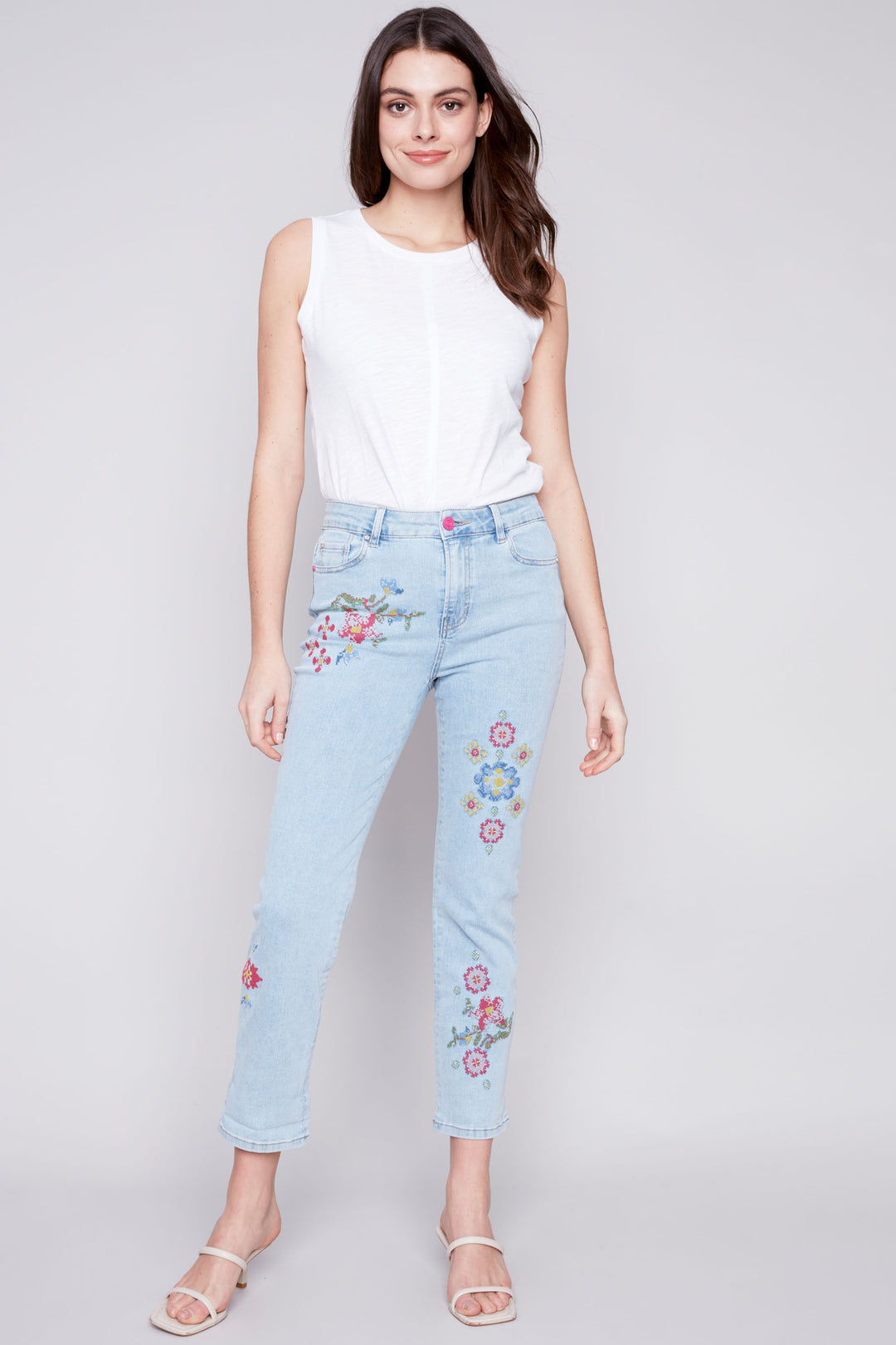 Expertly crafted with a classic 5 pocket design, these jeans feature a beautiful floral pattern with cross stitch embroidery. 