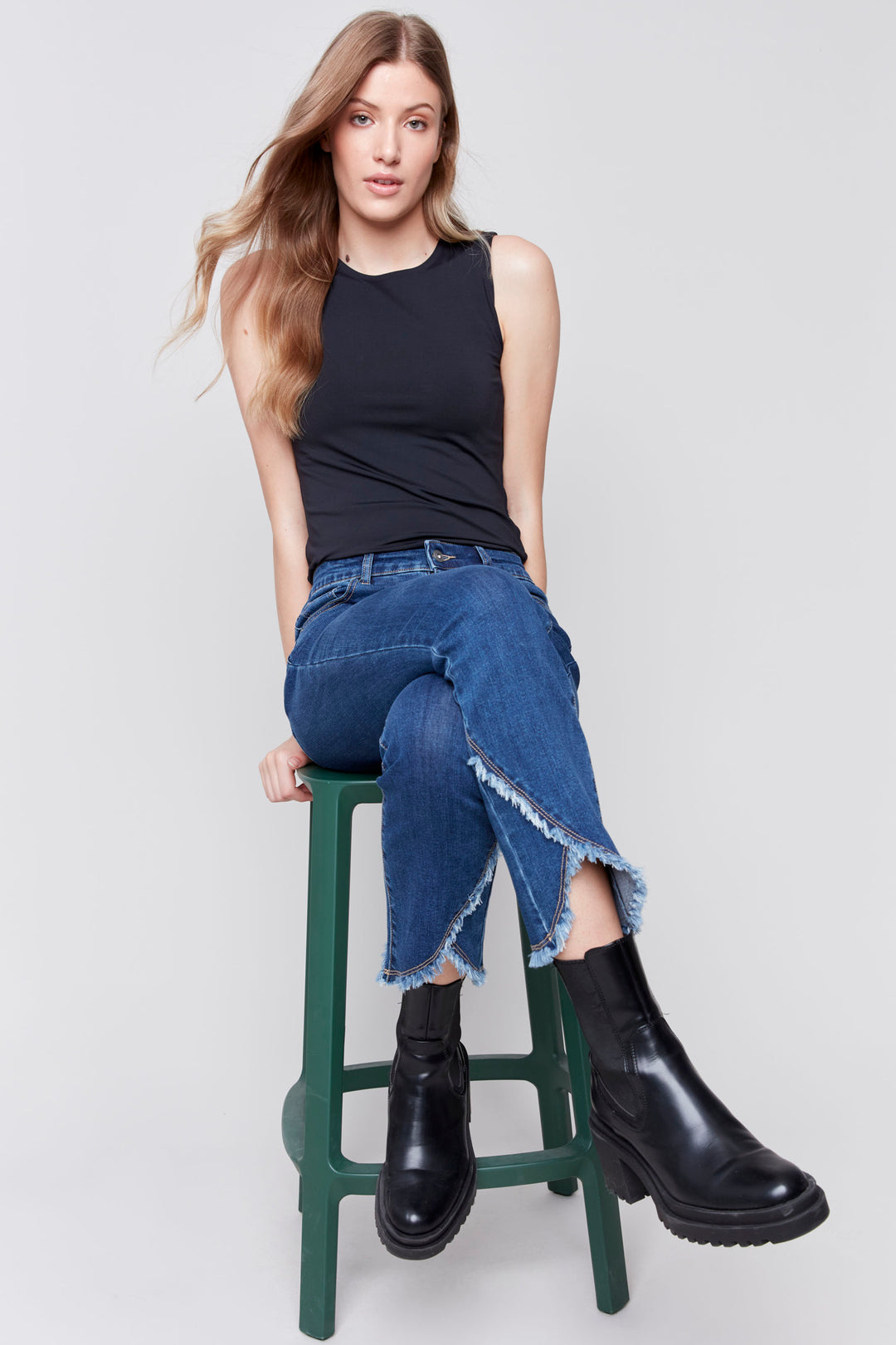 Charlie B Fall 2024 Crafted with a super stretchy denim and a unique tulip hem featuring a frayed, raw edge, these well-fitted ocean deep blue jeans will make a statement with every step!