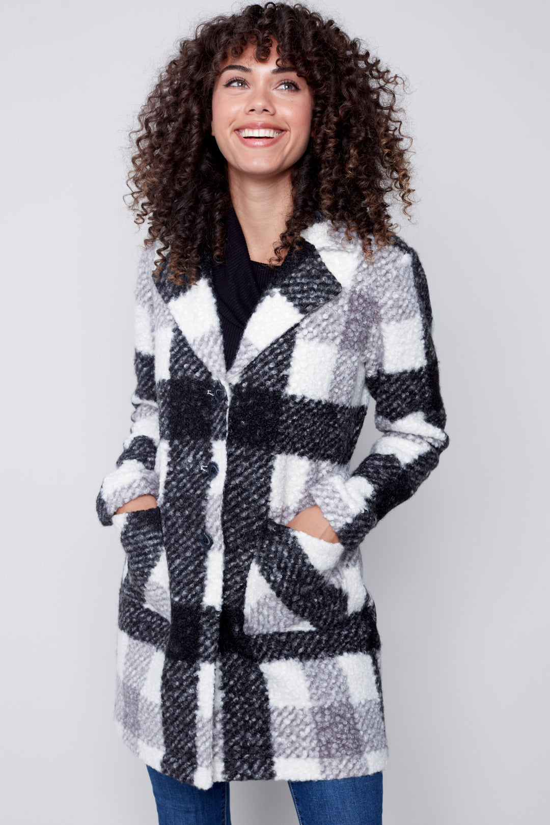 A luxurious bouclé knit coat tailored to provide a comfy and elegant look.