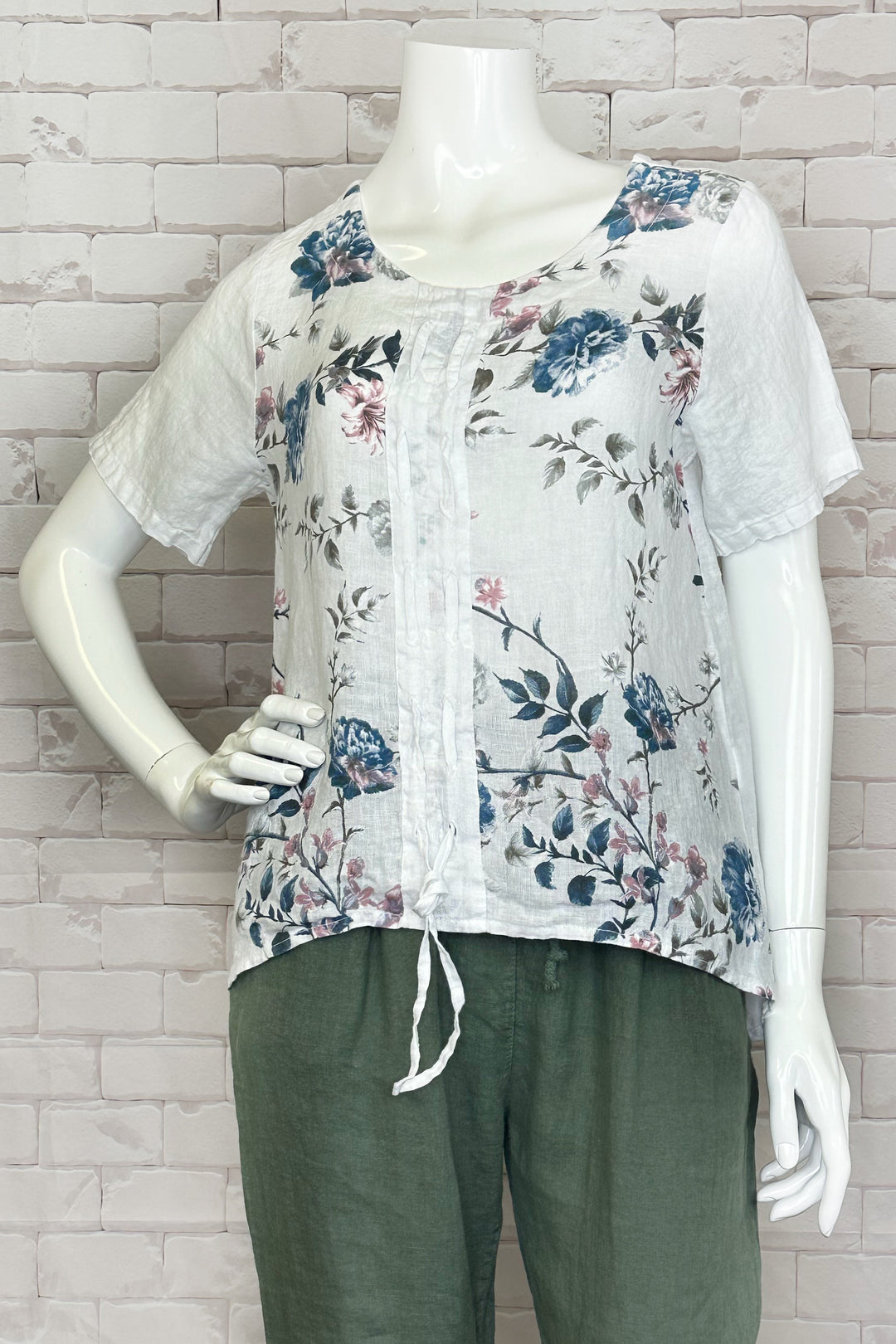 CHERISHH Spring 2024 This lovely top features a colourful floral print and short sleeves design, perfect for warmer weather. With a front drawstring, it's both stylish and comfortable
