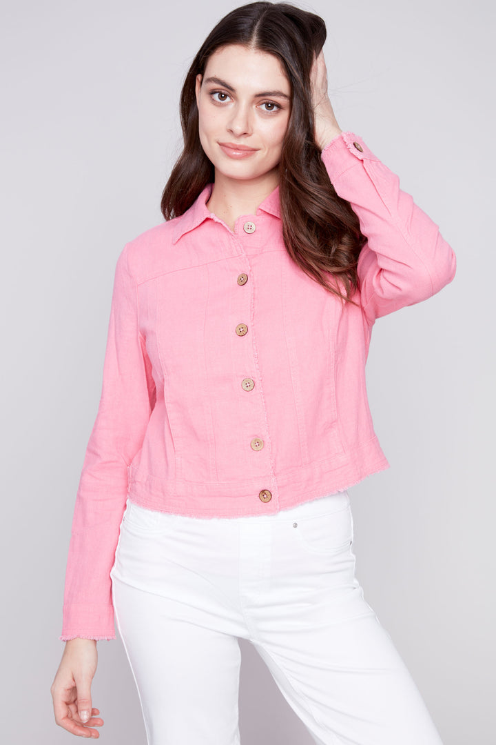 The front button closure and to the hips length provide a flattering fit, while the front pockets add functionality.