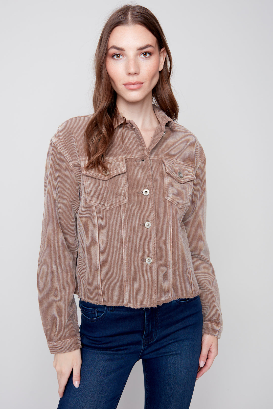 This 100% cotton Washed Cord Jacket is designed with washed-out corduroy and a raw-edge hem. Its button-front and pockets provide ample utility for all your needs.
