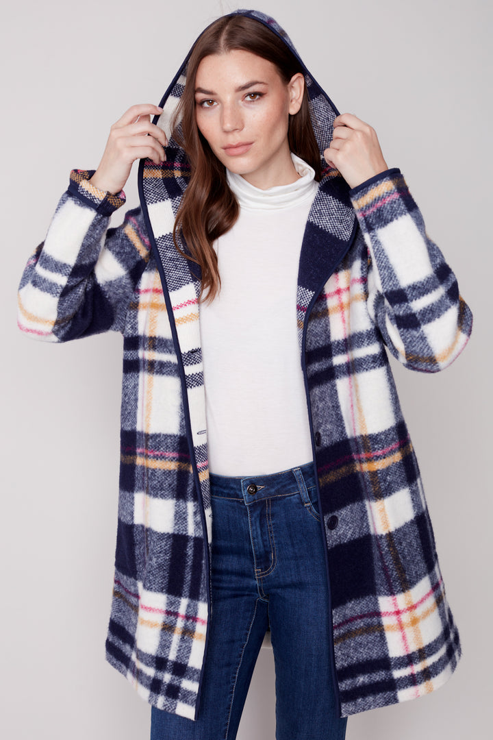 Stay warm and stand out in this plaid boiled wool hoodie jacket. The bright and distinct plaid pattern brings style to your wardrobe while the pockets and button front provide all the functionality you need. 