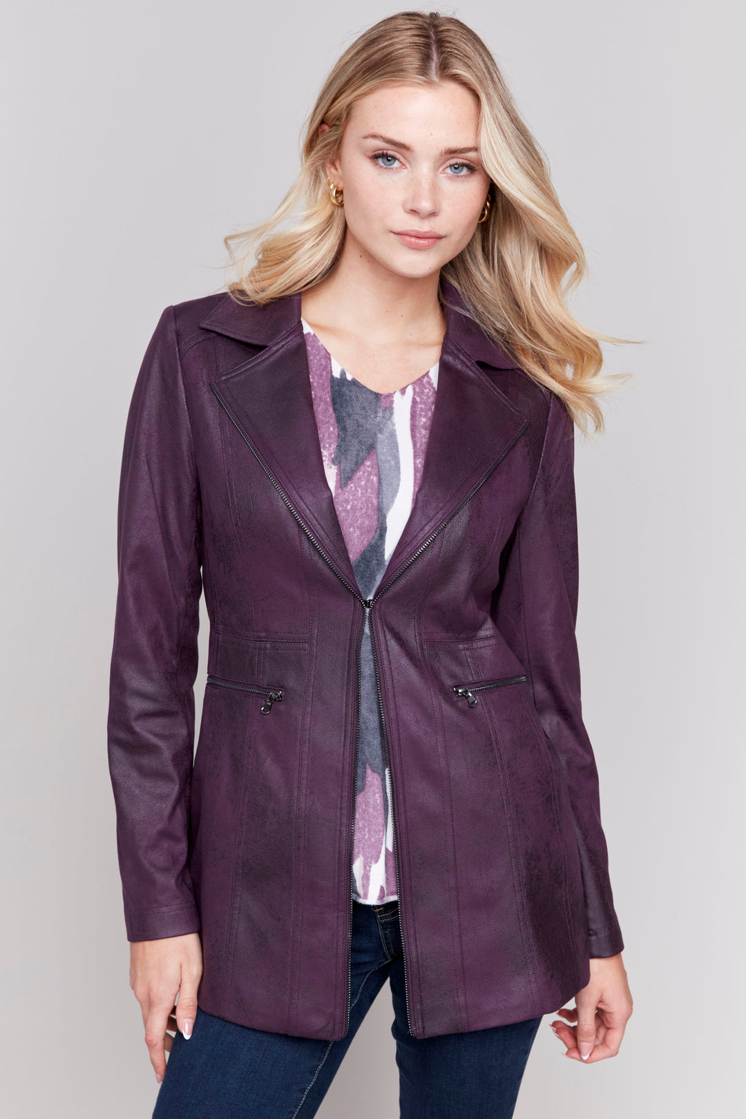 Charlie B Fall 2024 This on-trend jacket boasts a wide lapel, faux leather fabric and edgy zipper details throughout. 