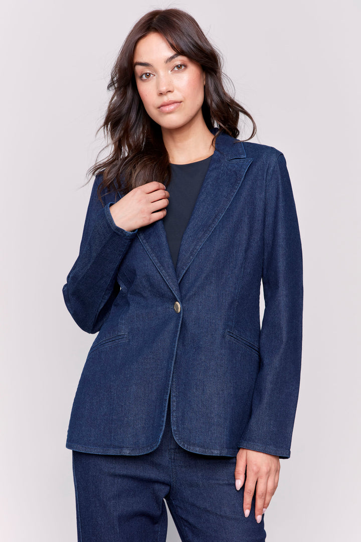 Charlie B Fall 2024 This long blazer features a one button closure, convenient pocket, and is perfect for the season. With a professional and stylish look, make a statement with this stunner of a denim jacket blazer.