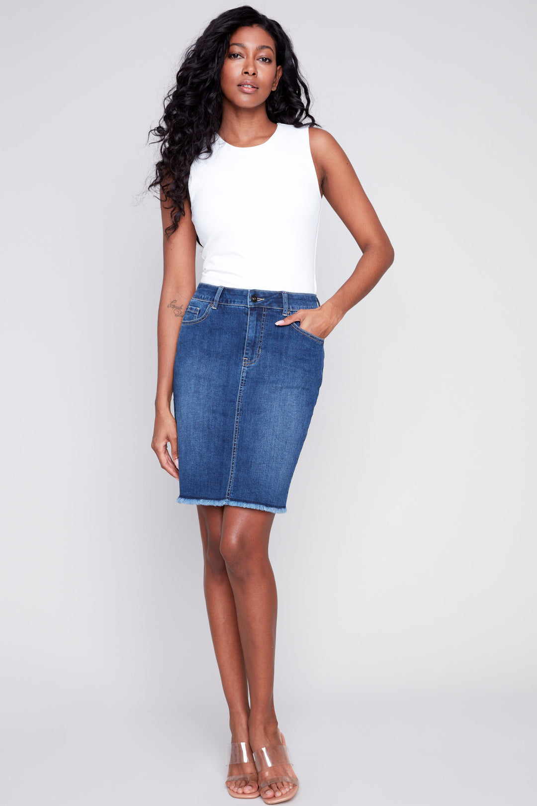 Made with 5 pockets and a classic denim design, this skirt will elevate any outfit. Its standard rise and signature frayed hem add a touch of luxury, making it the star of the show! 