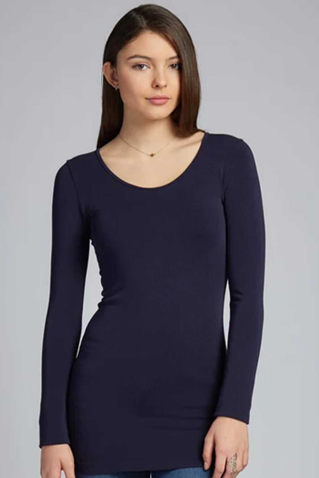 The bamboo-blend fabric offers a seamless look, is super stretchy and it will not pill. It’s the perfect layering piece!