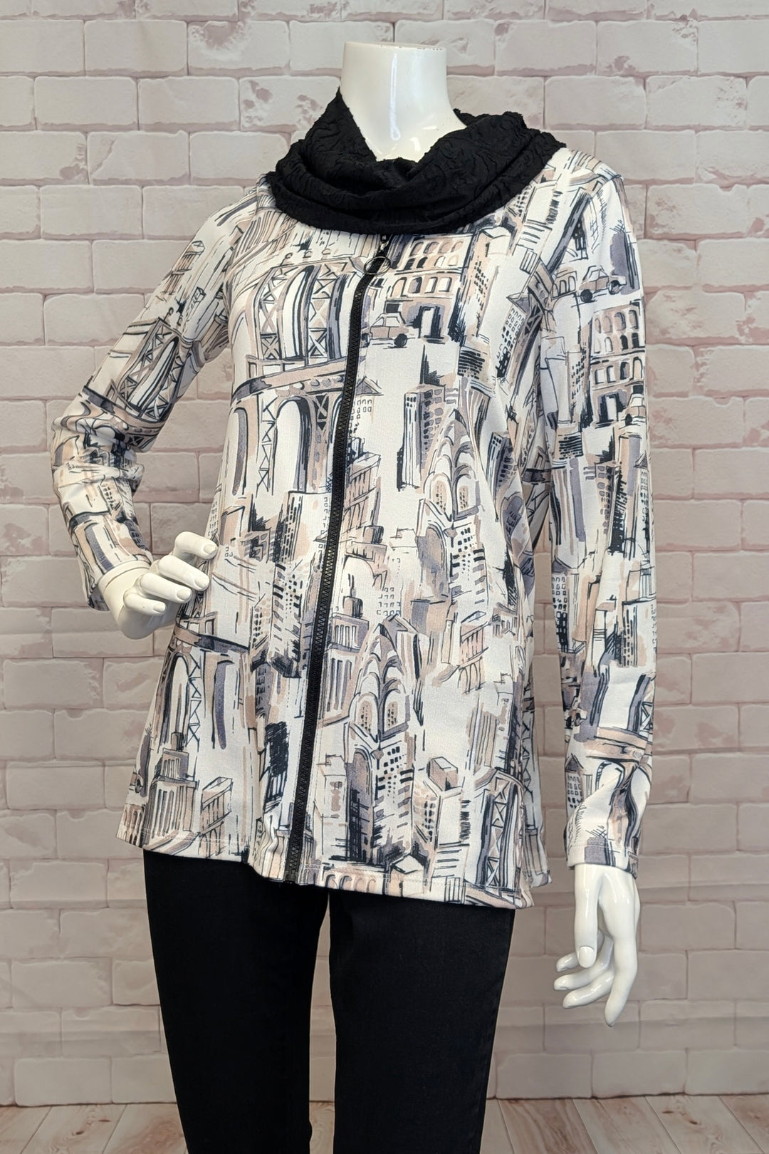 MICHAEL TYLER Fall 2025 
This playful piece features a bold contrast black cowl neck and a handy front zipper for easy wear. Crafted from light sweater knit fabric, it offers cozy comfort without the bulk. Double-stitched cuffs and hem add durability, while the neat city print all over brings a modern, urban vibe to your look.