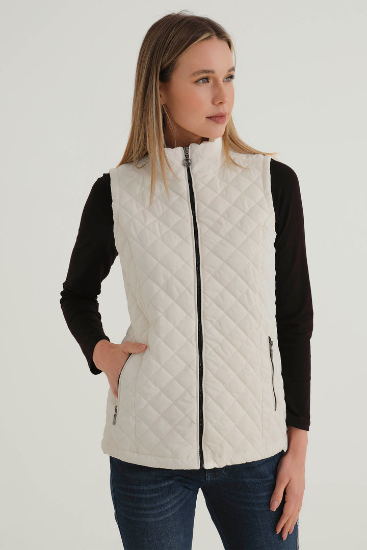 Dolcezza Fall 2024 With a bold quilted design pattern all-over, side zip pockets, funnel neck, it exudes sophistication and is perfect for any occasion this season.