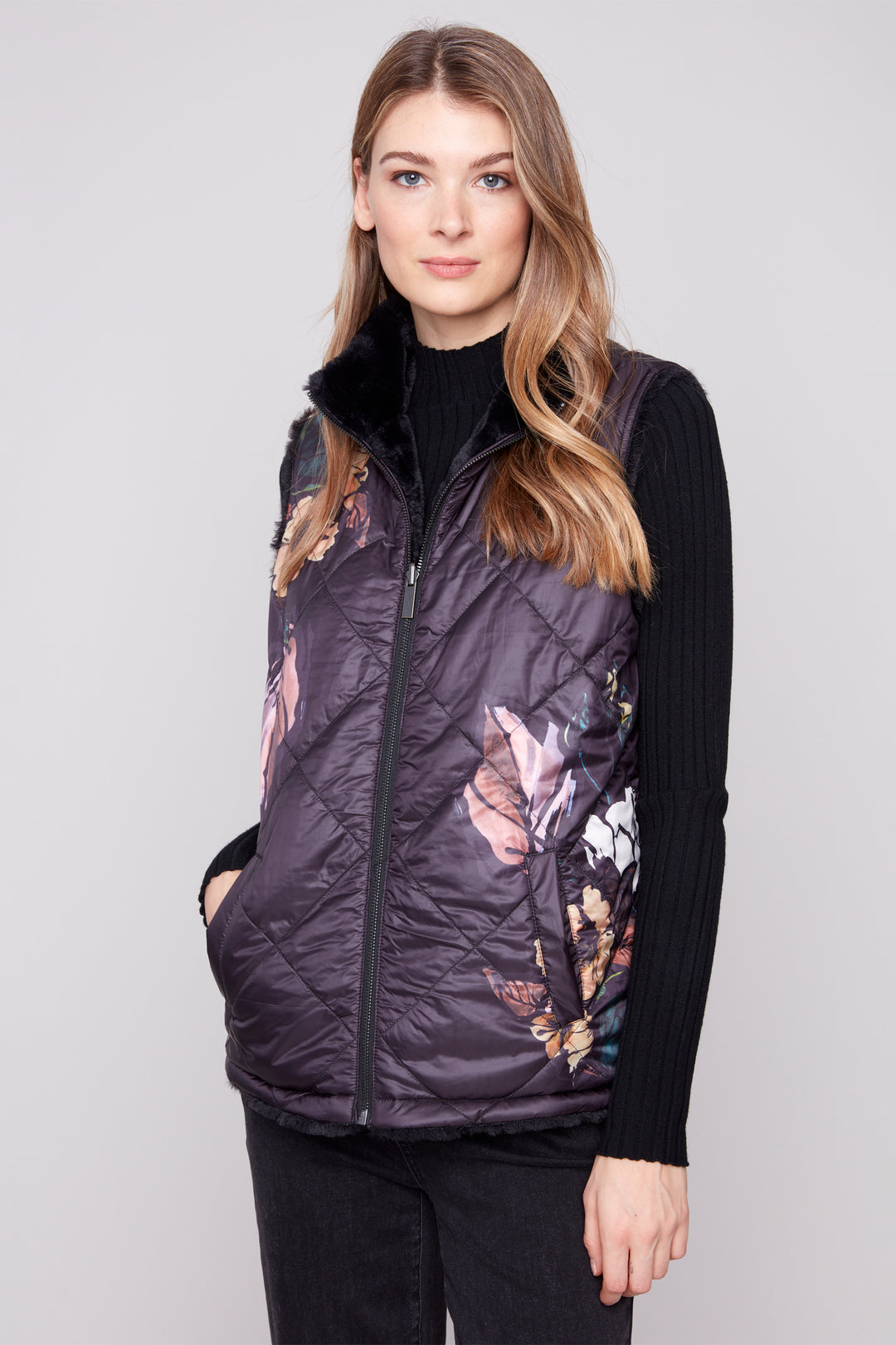 Charlie B Fall 2025 
Elevate your wardrobe with this sophisticated 2-in-1 reversible vest, featuring a bold floral pattern on one side and super-soft faux fur on the other.