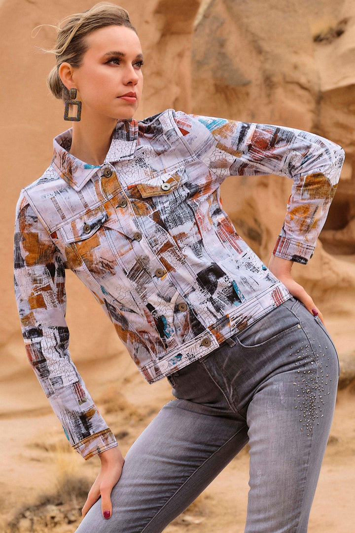 This unique piece features an all-over print, visible seams, a collar, button cuffs, two faux breast pockets and front buttons.