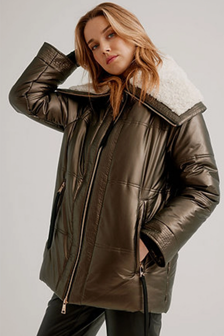 Graced with a berber lined large collar, quilted moto style and faux leather, it's a luxurious way to stay cozy.