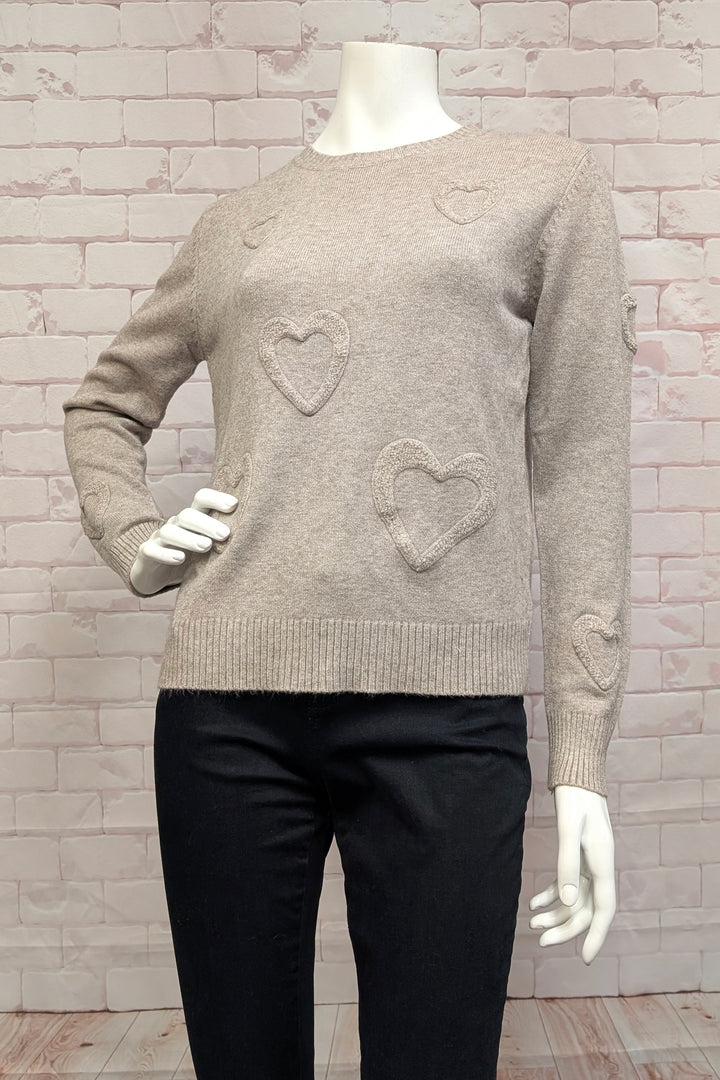 ETERN Fall 2025 
This long-sleeve sweater top features charming stitched fuzzy hearts on the front for a playful touch. Its contrast ribbed round neck, cuffs and hem add subtle detail, while the regular fit offers comfortable ease.