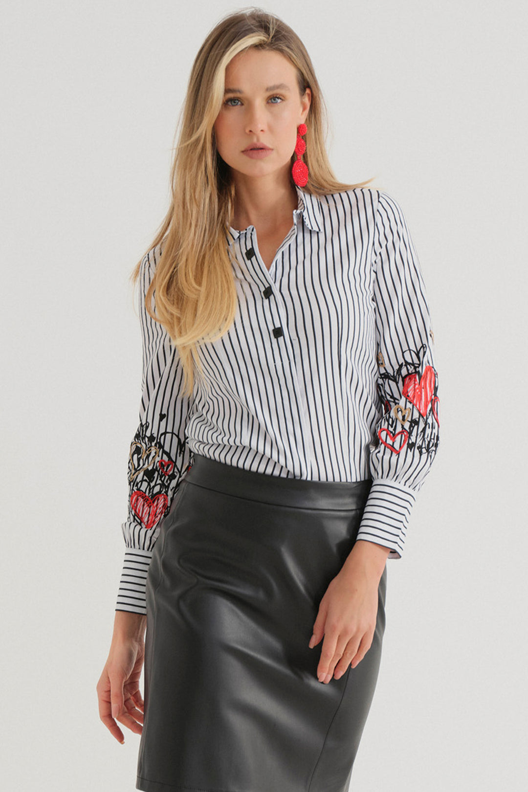 Dolcezza Fall 2024 
This Watermelon Heart Stripe Shirt is made from stretchy cotton fabric, ensuring superior comfort. The front features 3 black square signature buttons, adding a touch of sophistication. The contrasting cuffs and stripe design give it a classic blouse look. 