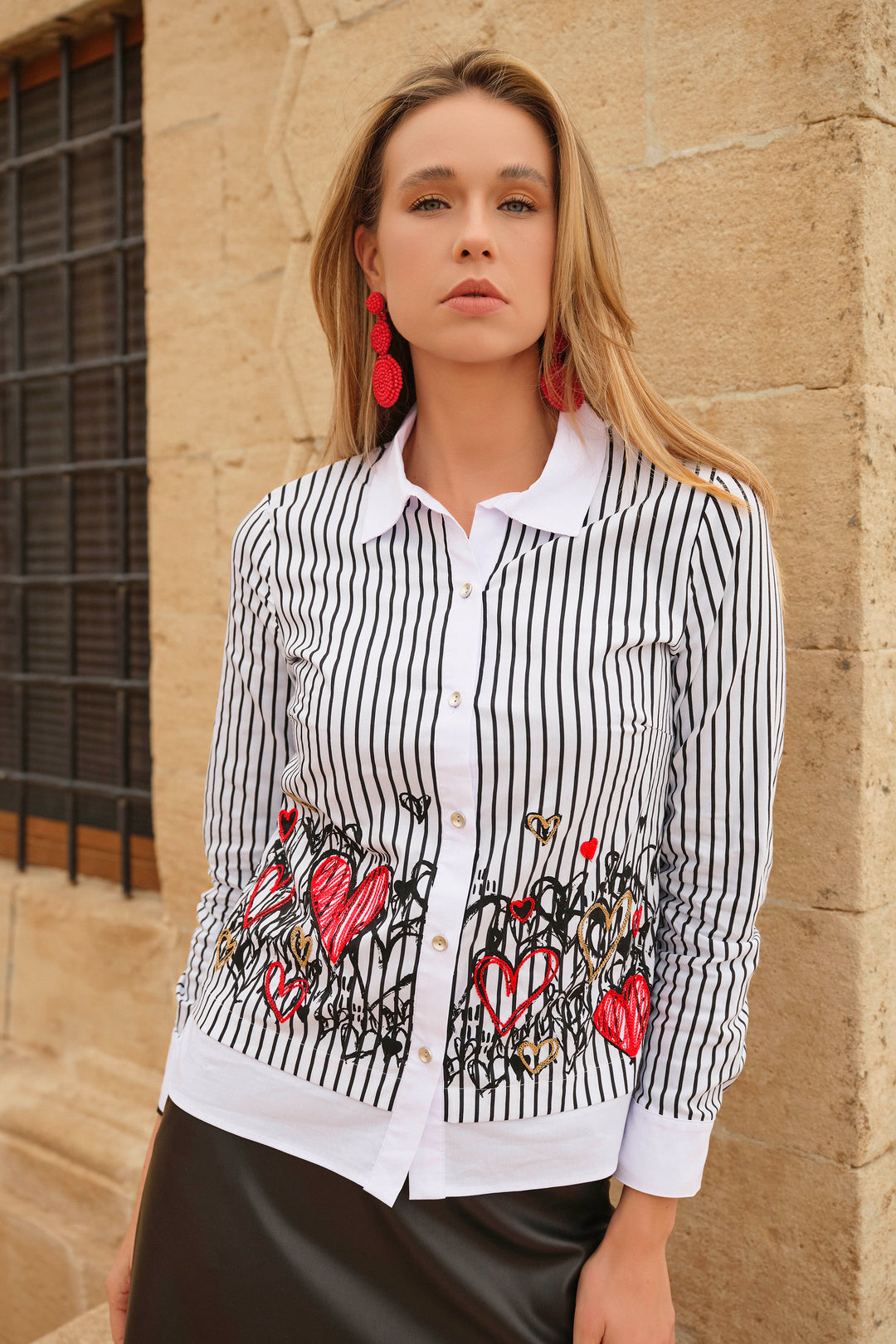 Dolcezza Fall 2024 It is made with breathable and stretchy cotton fabric for superior comfort. Featuring the lovely new hearts themed print, long sleeves, a classic collar, pinstripe design and front buttons, this top combines style and function.