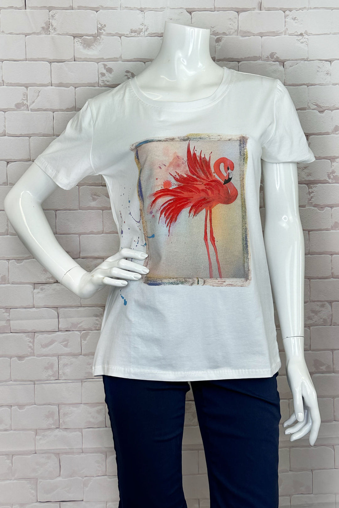 Ness Spring 2024 The round neckline and short sleeves make it easy and comfortable to wear, while the vibrant flaming flamingo print on the front adds a touch of fun and playfulness to any outfit. 