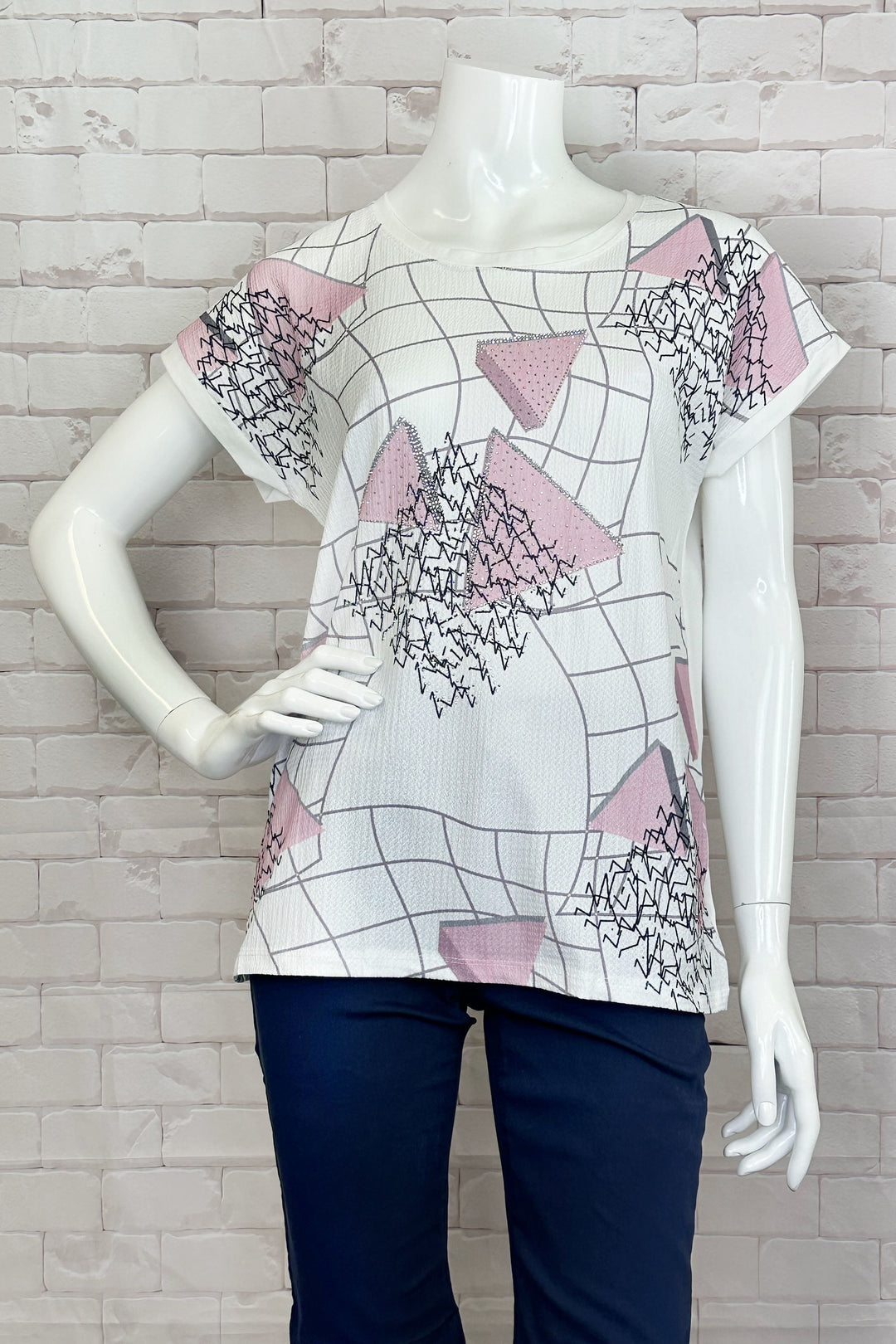 Ness Spring 2024 The round neckline and short sleeves make it easy and comfortable to wear, while the pink geo abstract print on the front adds a touch of fun and playfulness to any outfit.