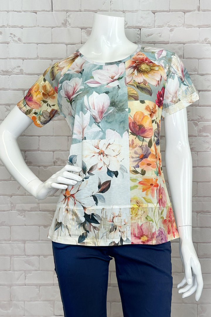 Ness Spring 2024 The round neckline and short sleeves make it easy and comfortable to wear, while the colourful floral wild spring flowers print on the front adds a touch of fun and playfulness to any outfit.