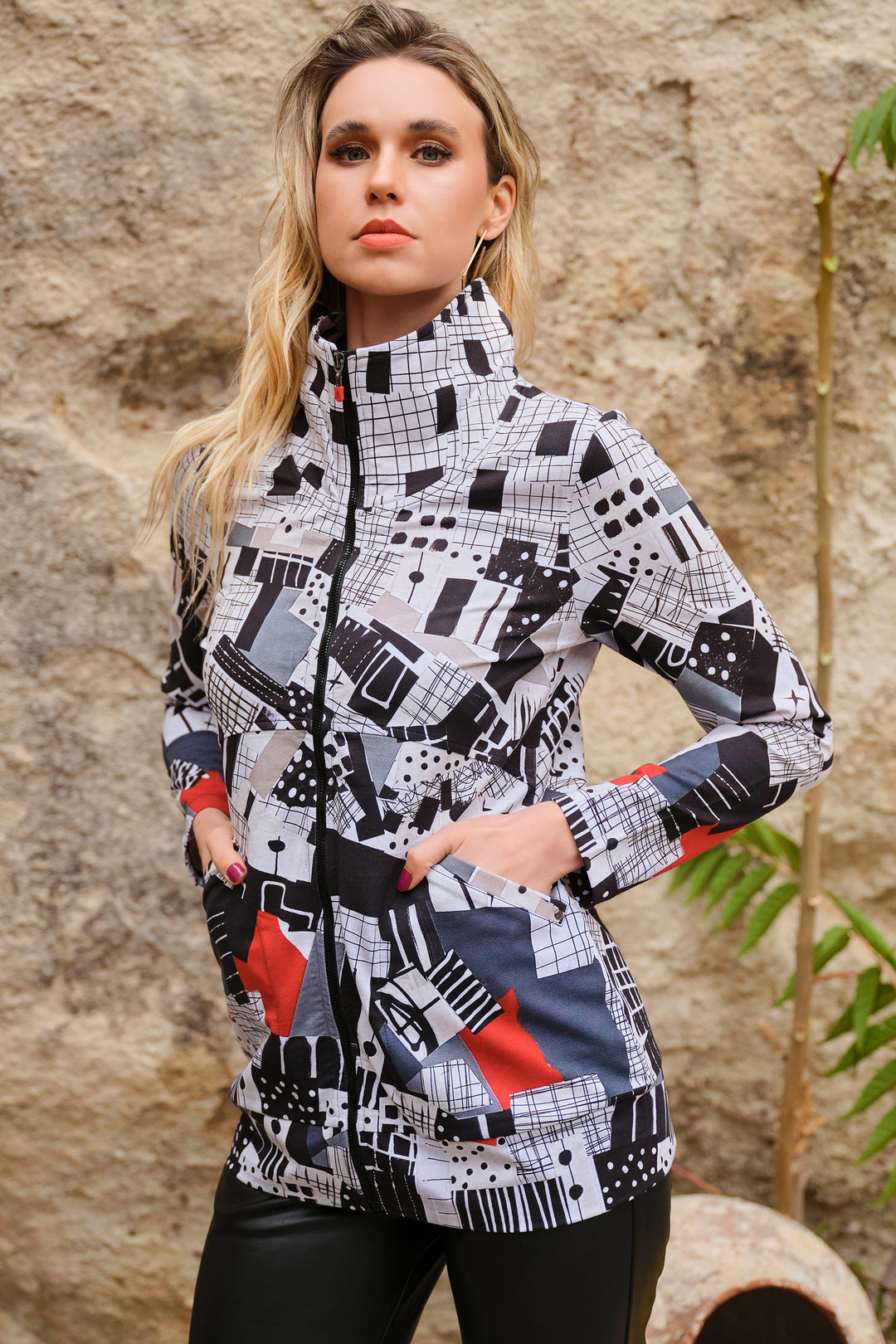 Crafted from a soft cotton-blend fabric, this ultra-chic cardigan-style jacket features an all-over abstract geometric print and a high neckline with a front zipper to ensure a snug fit. 