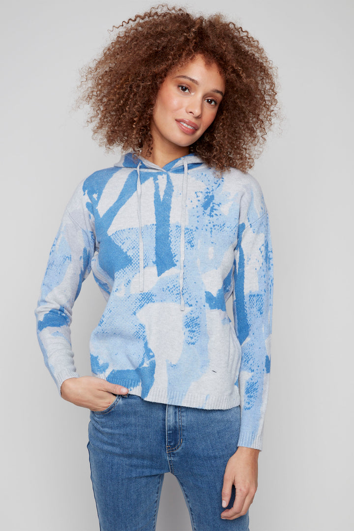 Charlie B F25  
Made with plush knit fabric, you'll love the soft touch against your skin. The full length sleeves make it perfect for any casual occasion. The rounded hem and drawstring hood add an element of style.