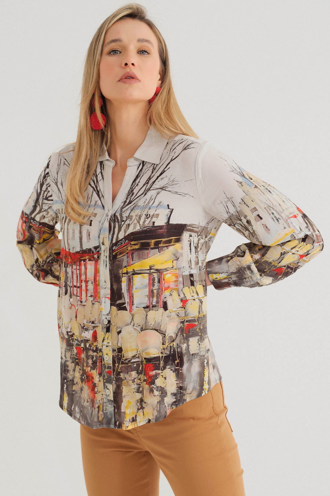 Dolcezza Fall 2024 This long sleeve viscose blouse features a beautiful Parisian art print, classic collar, front buttons and light comfortable fit.