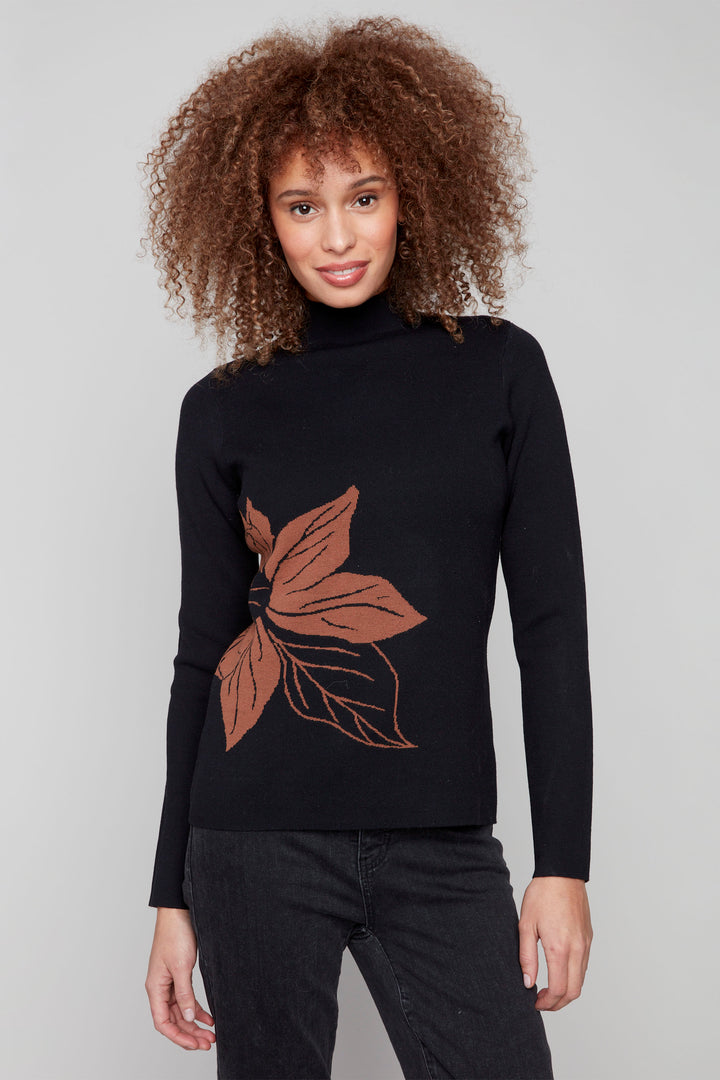 Charlie B Fall 2025 
Crafted from a soft, lightweight knit, it ensures comfort and a refined fit. The mock neck adds a polished touch, making it ideal for layering or wearing solo.