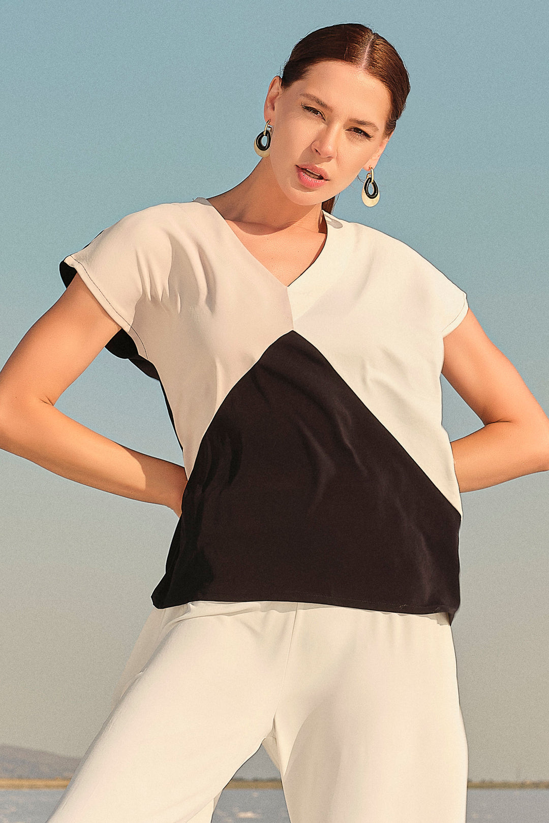 Ever Sassy Spring 2024 With its contrast solid colour back and sharp cut v-neck, this top is both stylish and comfortable