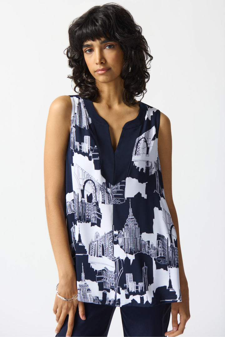  This light and loose top features a daring split collar and bold cityscapes from around the world! 