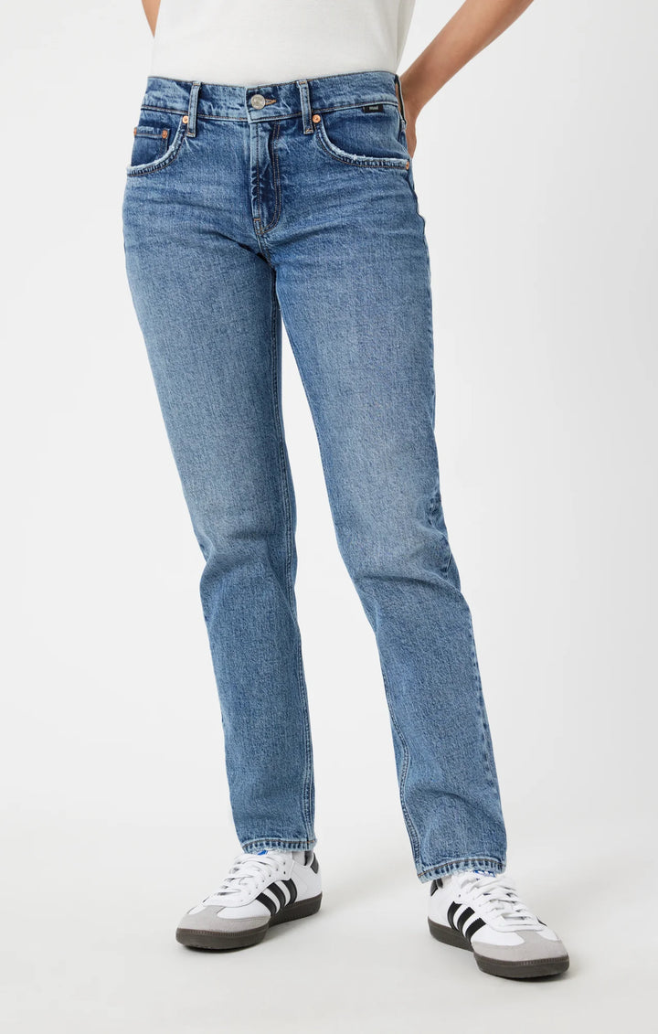 Mavi Fall 2024 Effortlessly stylish with a comfortable fit, the soft cotton blend Mirella Slim Straight jeans feature an easy wear design and mid rise waistline. 